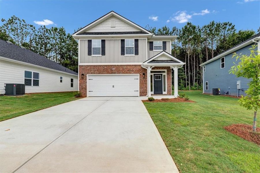Front exterior of a new home in Canterbury Villas, Carrollton, GA, highlighting curb appeal (Image 19).