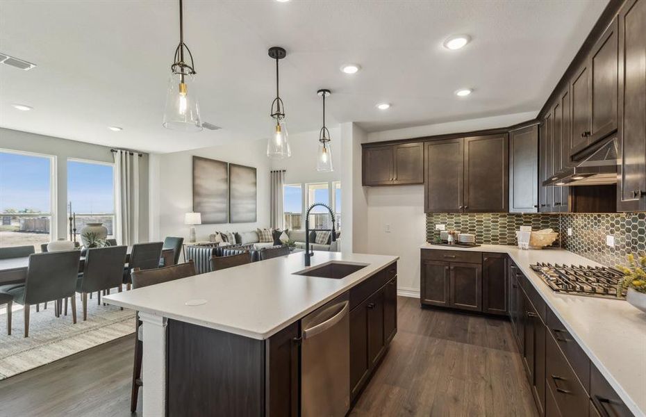 High-end gourmet kitchen with premium finishes and upgraded appliances *Model representation