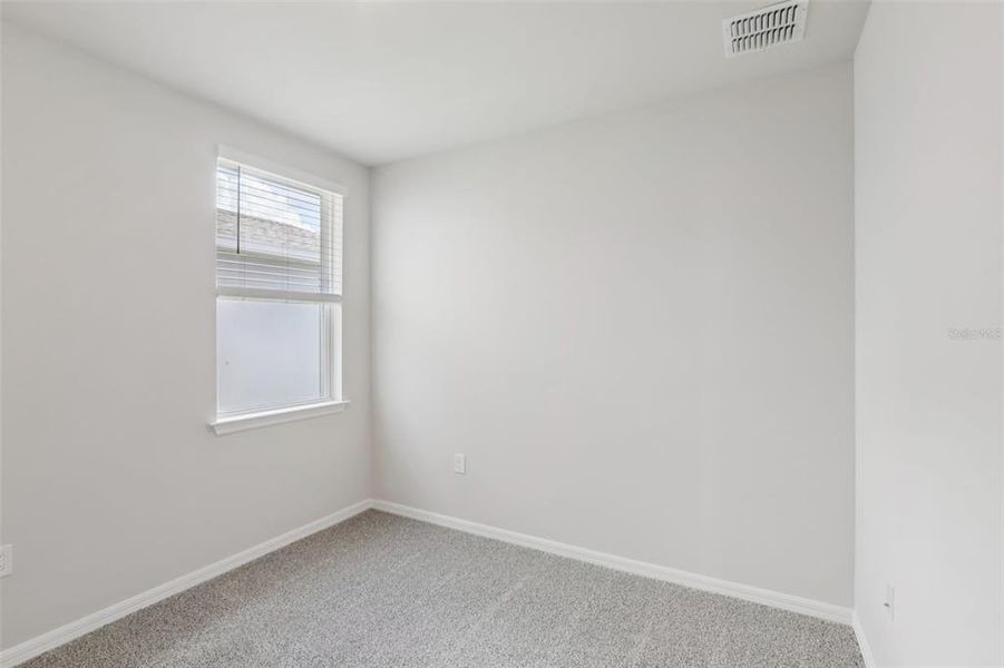 Spacious, unfurnished interior of a new home in Crescent Lakes - Premier Series, Punta Gorda (Image 30).