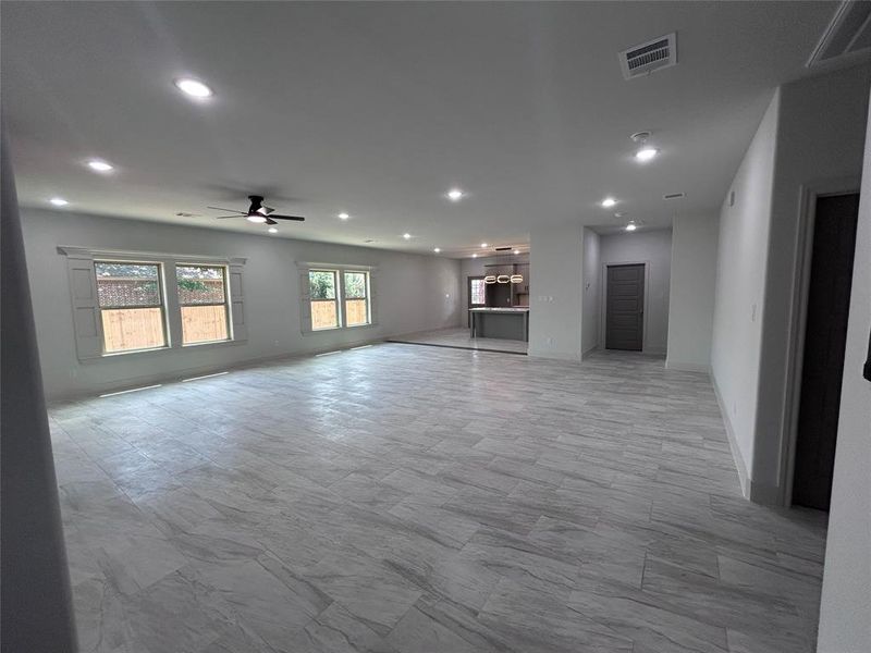 Unfurnished living room with ceiling fan and recessed lighting Unfurnished living room with ceiling fan and recessed lighting