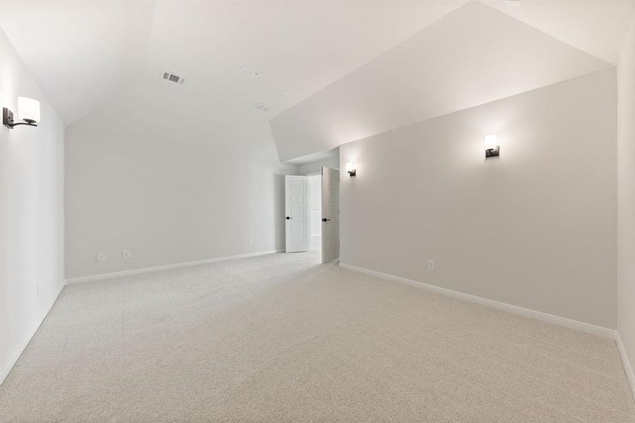 This spacious media room with adjacent game room create the ultimate family entertainment zone!