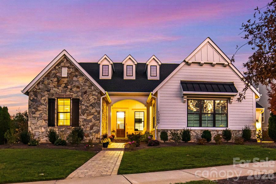 Front exterior of a new home in , Huntersville, NC, highlighting curb appeal (Image 21).