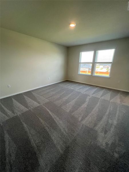 Primary bedroom with recessed lighting
