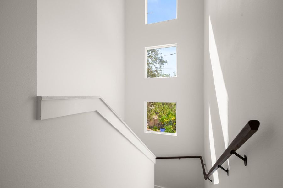 Stairs featuring a high ceiling