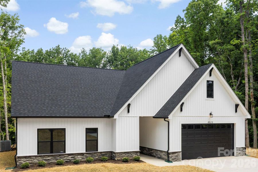 Front exterior of a new home in , Gastonia, NC, highlighting curb appeal (Image 23).