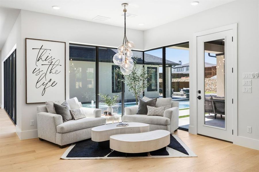 The breakfast nook overlooks the pool with a wall of windows! Current owners use this space as a relaxing morning sitting area. The breakfast nook overlooks the pool with a wall of windows! Current owners use this space as a relaxing morning sitting area.