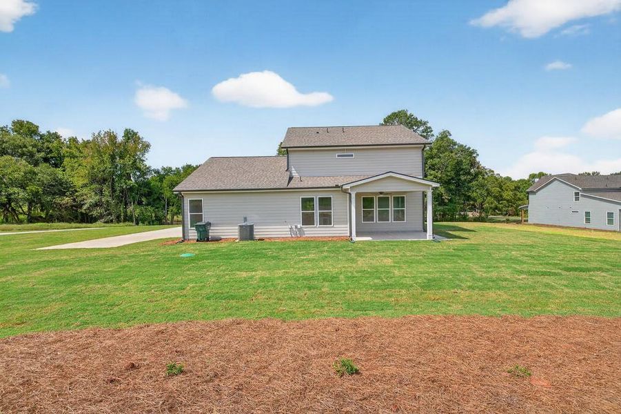 Front exterior of a new home in Magnolia Ridge, Monroe, GA, highlighting curb appeal (Image 22).
