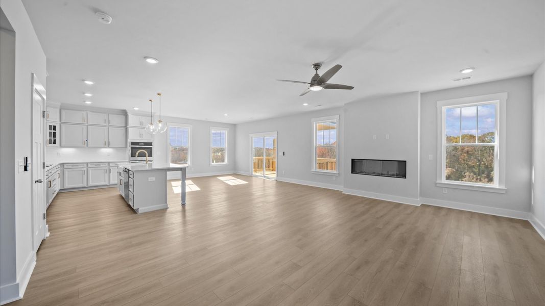 Elegant family room with hardwood flooring and open-concept flow in this first-class DRB Homes design