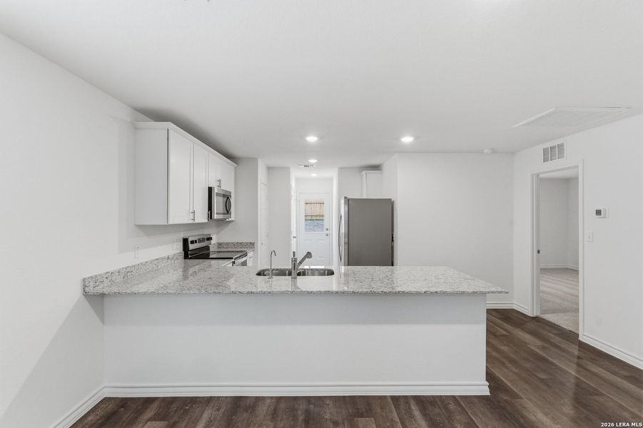 Furnished interior view inside a new home in Cinco Lakes, San Antonio (Image 6).