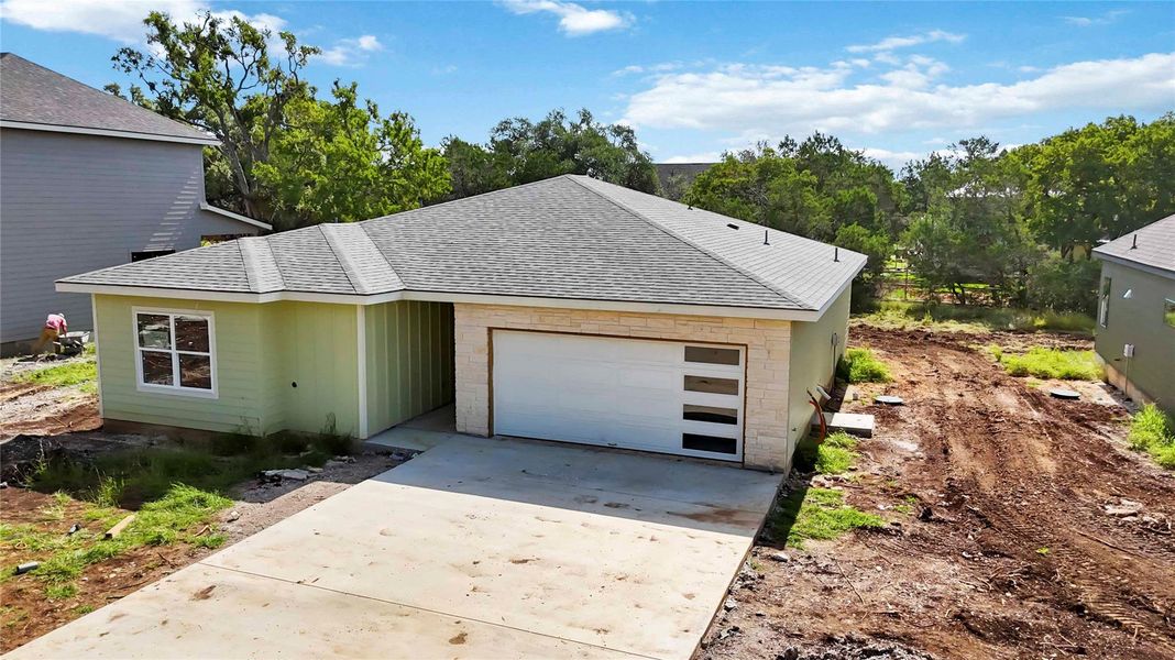 Front exterior of a new home in , Wimberley, TX, highlighting curb appeal (Image 22). Front exterior of a new home in , Wimberley, TX, highlighting curb appeal (Image 22).