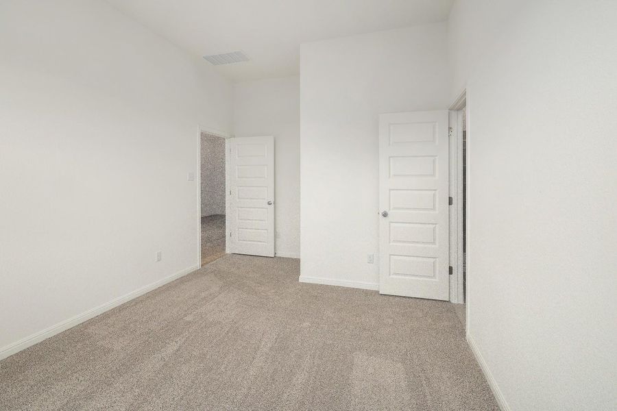 Primary Bedroom in the Ash home plan by Trophy Signature Homes – REPRESENTATIVE PHOTO Primary Bedroom in the Ash home plan by Trophy Signature Homes – REPRESENTATIVE PHOTO