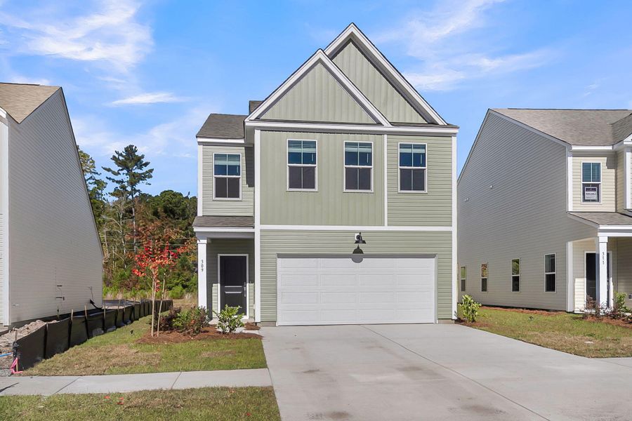Front exterior of a new home in Wildcat Chase, Summerville, SC, highlighting curb appeal (Image 2). Front exterior of a new home in Wildcat Chase, Summerville, SC, highlighting curb appeal (Image 2).