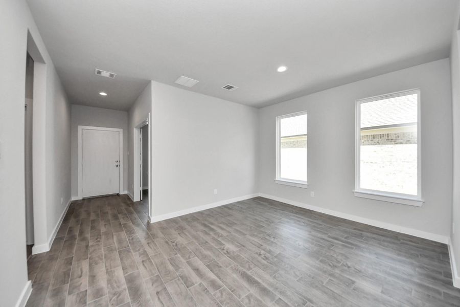 Discover another perspective of the dining room. Sample photo of completed home with similar floor plan. Actual colors and selections may vary.
