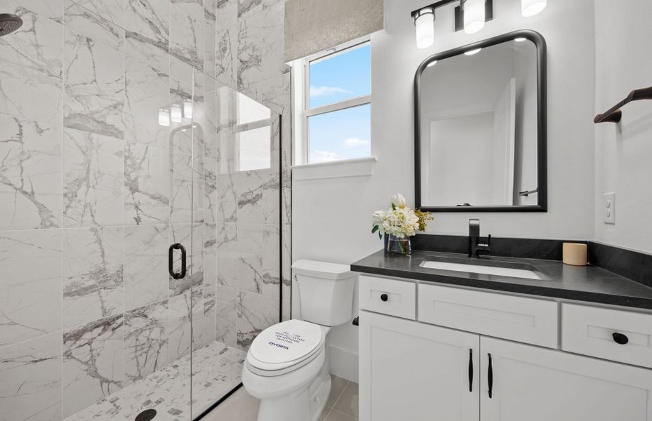 Representative furnished interior of a home built from the Layton Grande by DiVosta in BeachWalk by Manasota Key, Englewood (Image 18).