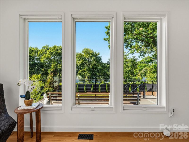 Light-filled primary suite offering private, open views of Beaver Lake