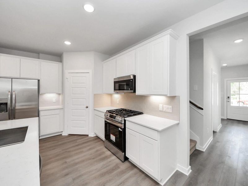 Furnished interior view inside a new home in Caney Creek Place, Conroe (Image 6).