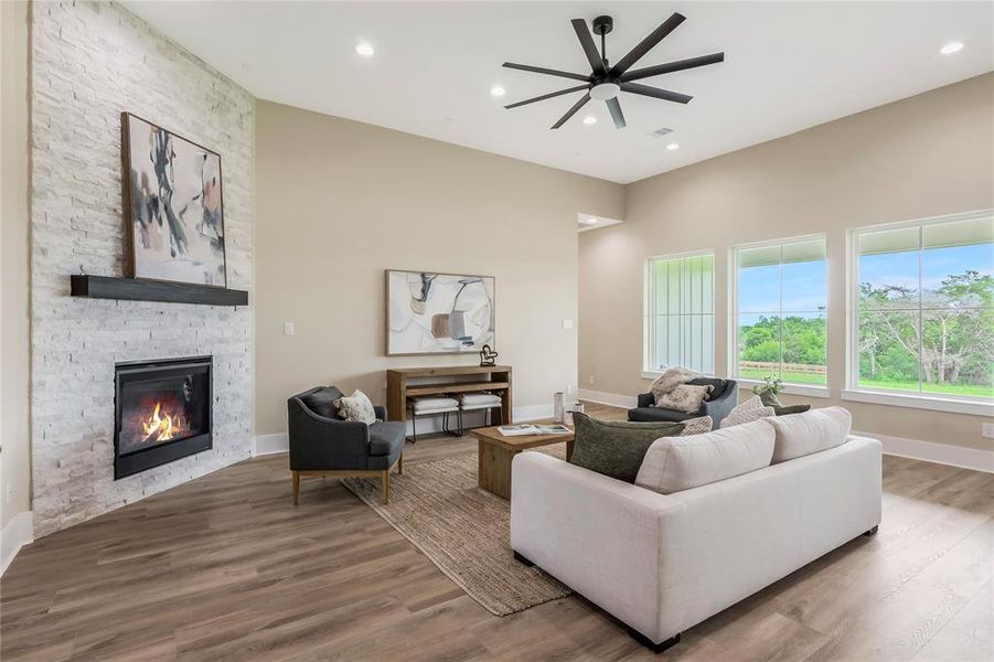 Fireplace surrounded by a stone accent wall. Fireplace surrounded by a stone accent wall.
