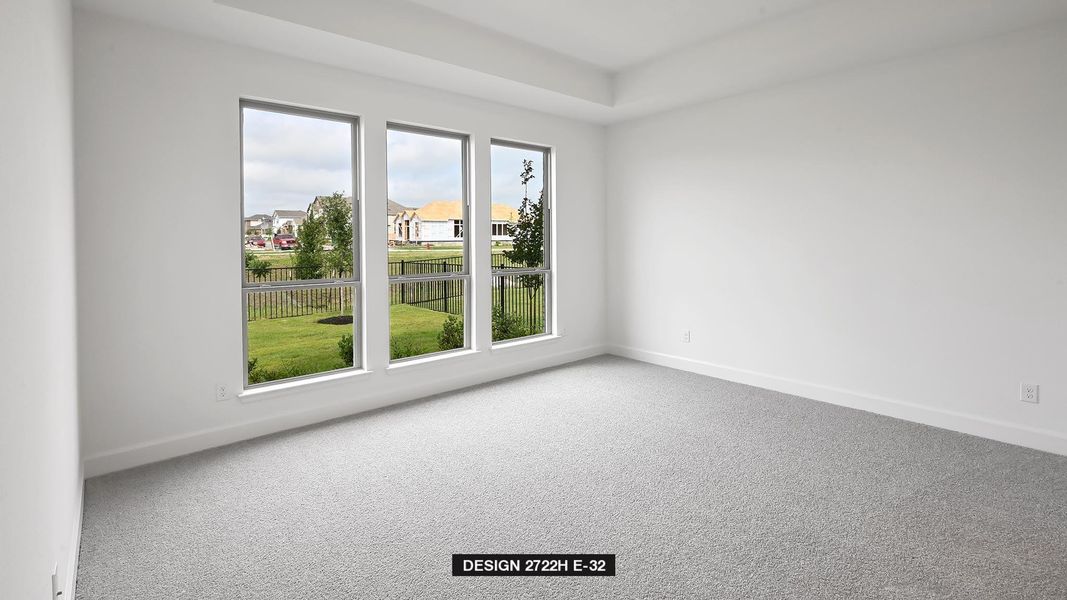 Carpeted empty room featuring baseboards