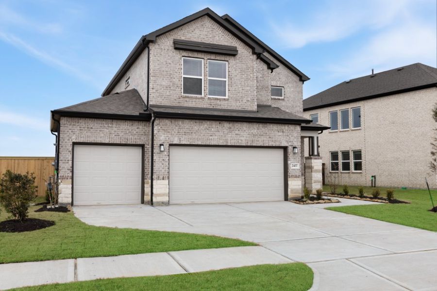 Front exterior of a new home in Creekhaven, Iowa Colony, TX, highlighting curb appeal (Image 21). Front exterior of a new home in Creekhaven, Iowa Colony, TX, highlighting curb appeal (Image 21).