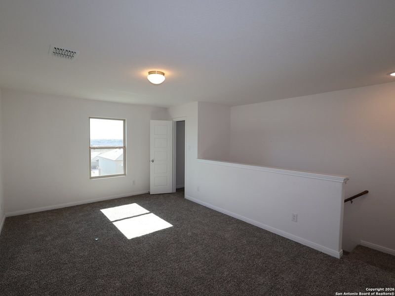 Spacious, unfurnished interior of a new home in Hunters Ranch, San Antonio (Image 15).