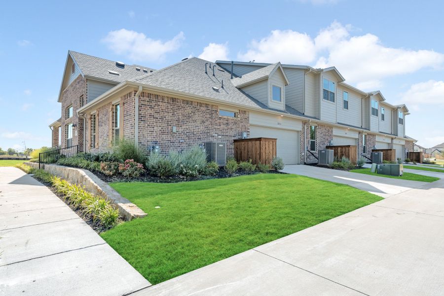 Front exterior of a new home in Cottonwood Creek, Rowlett, TX, highlighting curb appeal (Image 27).