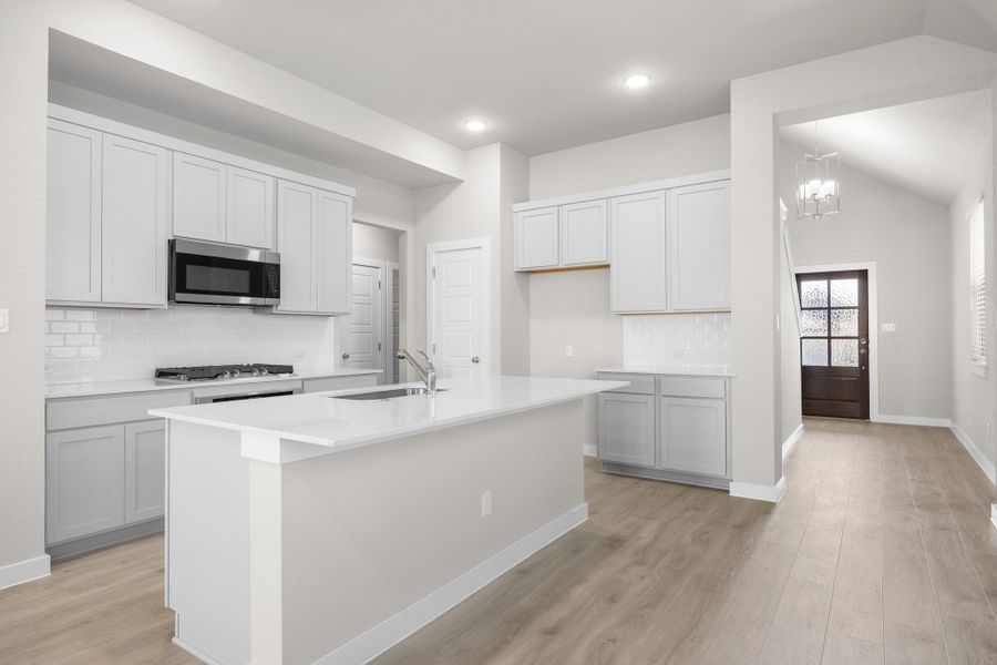 Kitchen in the Elm home plan by Trophy Signature Homes – REPRESENTATIVE PHOTO Kitchen in the Elm home plan by Trophy Signature Homes – REPRESENTATIVE PHOTO