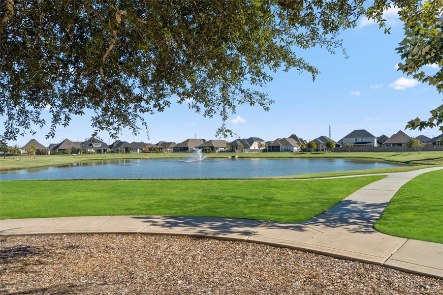 Scenic community lake with walking trails, perfect for relaxing walks or morning jogs.