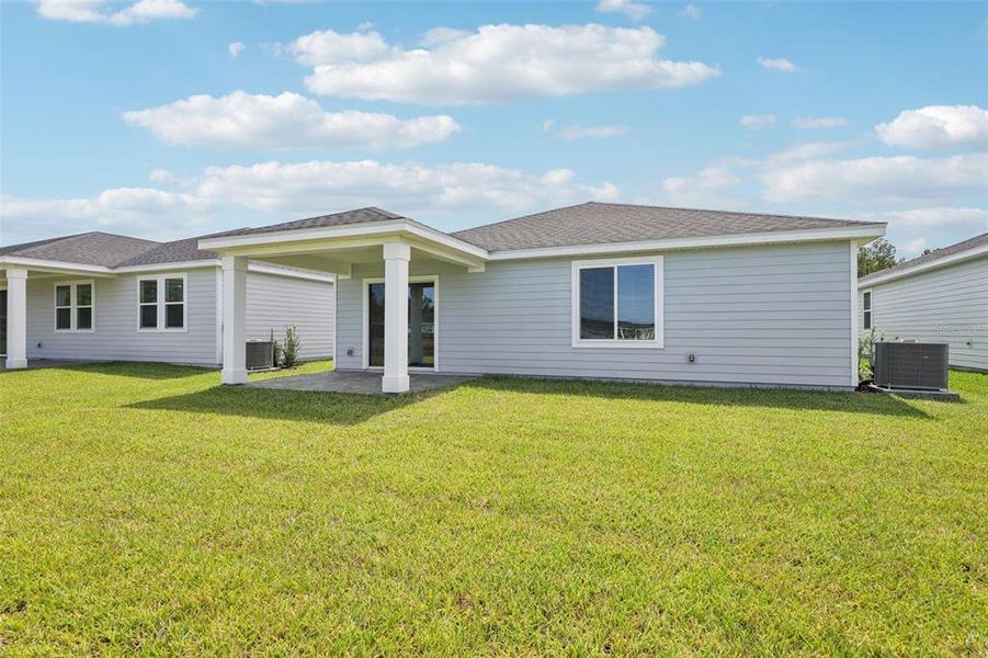 Exterior details and patio area of a home in Colbert Landings, Palm Coast (Image 20).