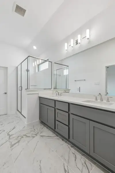 Primary Bathroom in the Claret home plan by Trophy Signature Homes – REPRESENTATIVE PHOTO