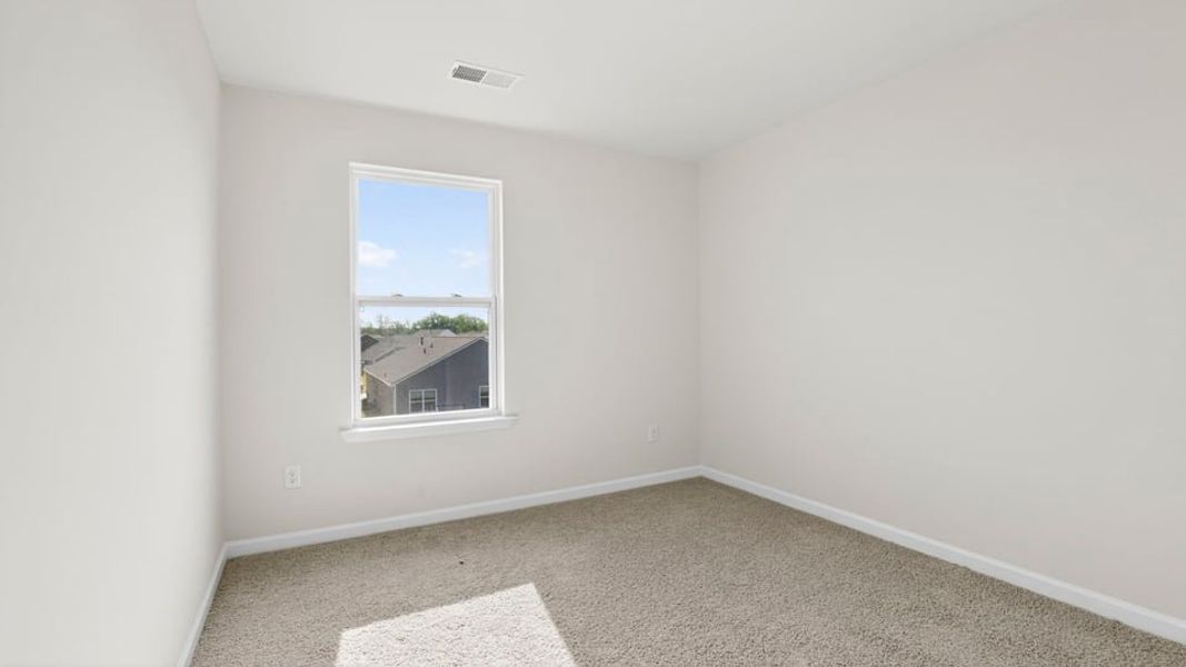 Spacious, unfurnished interior of a new home in Durbin Meadows Traditions, Fountain Inn (Image 26).