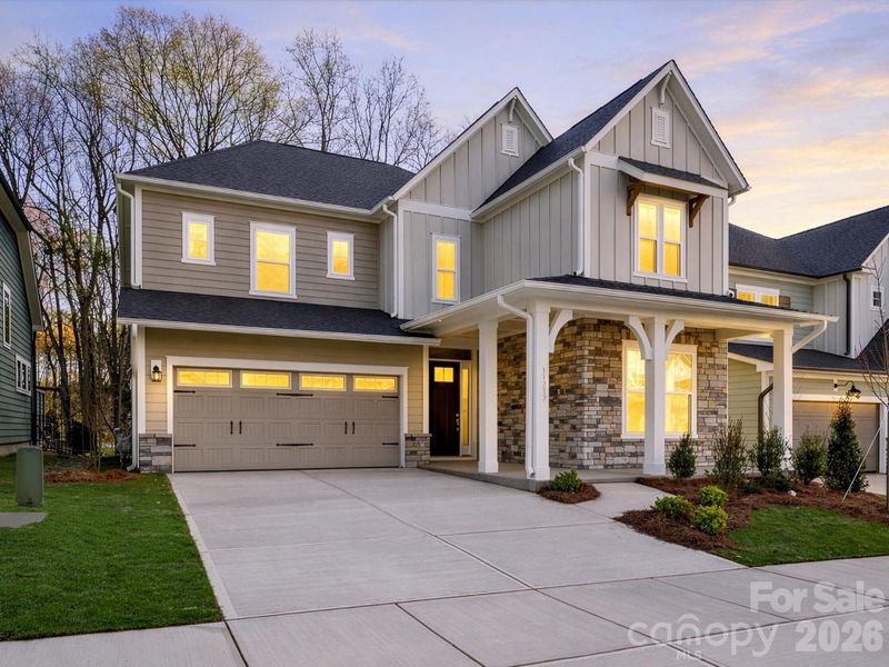 Front exterior of a new home in North Creek Village, Huntersville, NC, highlighting curb appeal (Image 25).