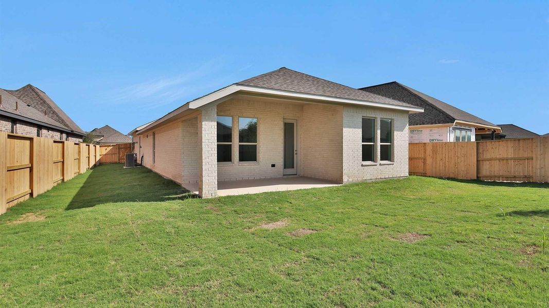 Exterior details and patio area of a home in Meridiana, Manvel (Image 2).