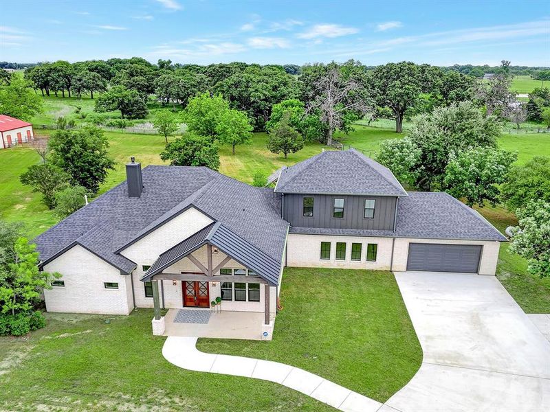 Front exterior of a new home in , Pilot Point, TX, highlighting curb appeal (Image 26). Front exterior of a new home in , Pilot Point, TX, highlighting curb appeal (Image 26).