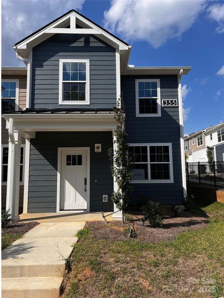 Front exterior of a new home in , Concord, NC, highlighting curb appeal (Image 2).