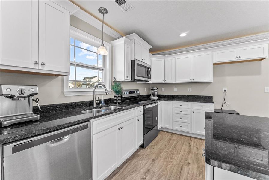 Representative furnished interior of a home built from the Sumter by Enchanted Homes in Ballentine Ridge, Lyman (Image 36).