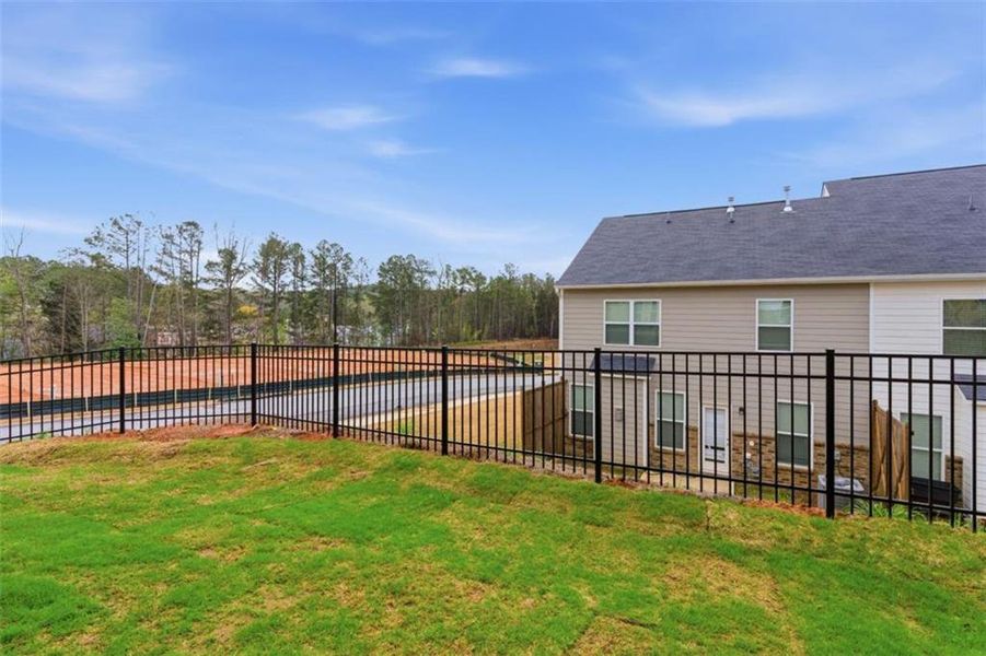 Exterior details and patio area of a home in Park Center Pointe, Mableton (Image 27).