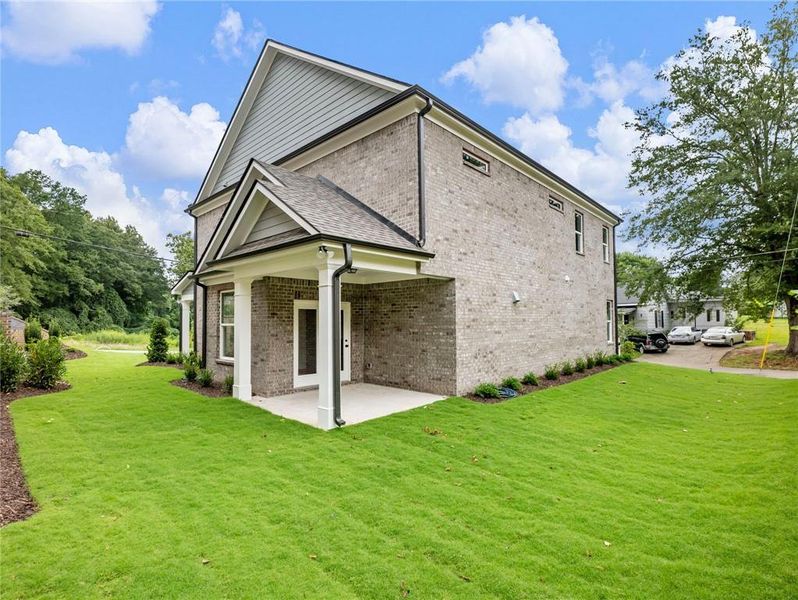 Front exterior of a new home in , Buford, GA, highlighting curb appeal (Image 1). Front exterior of a new home in , Buford, GA, highlighting curb appeal (Image 1).