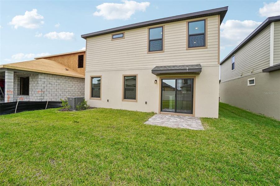 Exterior details and patio area of a home in Grasslands West, Lakeland (Image 22).