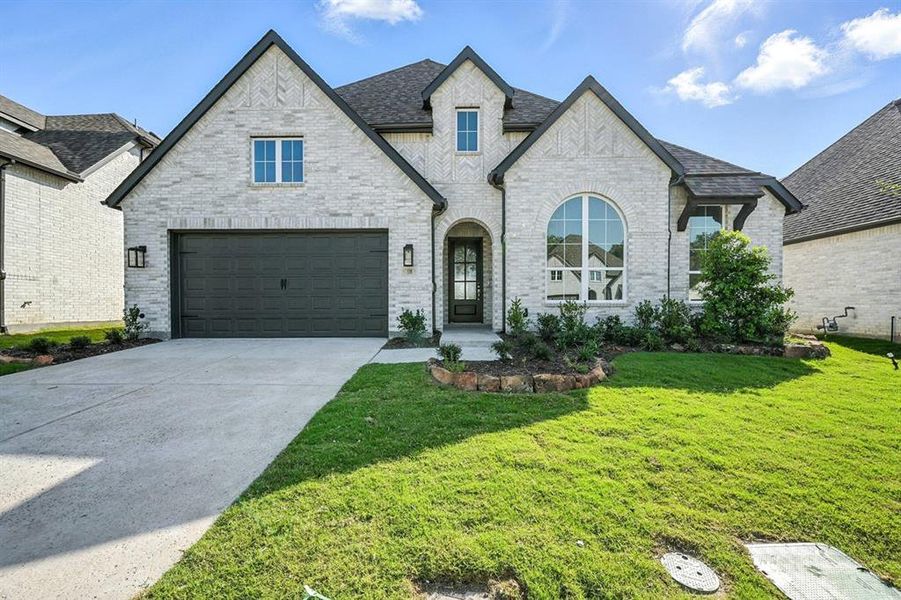 Front exterior of a new home in Thompson Farms: 60ft. lots, Van Alstyne, TX, highlighting curb appeal (Image 2). Front exterior of a new home in Thompson Farms: 60ft. lots, Van Alstyne, TX, highlighting curb appeal (Image 2).