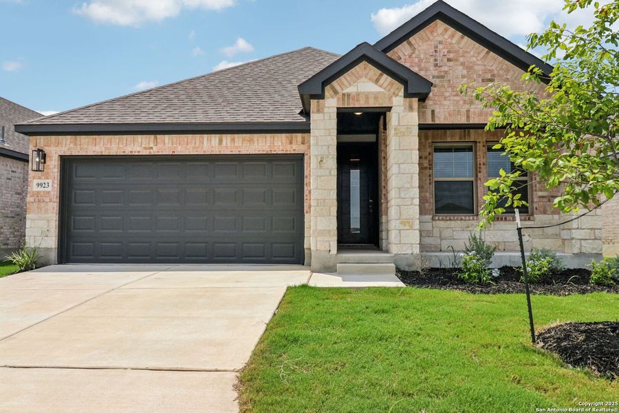 Front exterior of a new home in Kallison Ranch, San Antonio, TX, highlighting curb appeal (Image 24). Front exterior of a new home in Kallison Ranch, San Antonio, TX, highlighting curb appeal (Image 24).