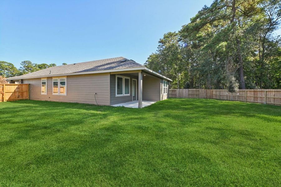Exterior details and patio area of a home in , Conroe (Image 23).