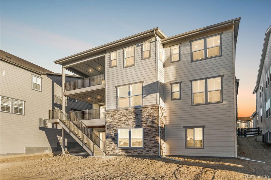 Exterior details and patio area of a home in Luxe at The Canyons, Castle Pines (Image 2).