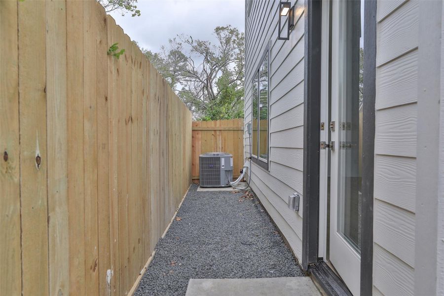 Low-maintenance backyard with a durable concrete slab and sleek bull rock design. Low-maintenance backyard with a durable concrete slab and sleek bull rock design.