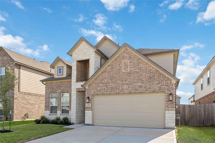 Front exterior of a new home in Eagle Landing, Houston, TX, highlighting curb appeal (Image 2). Front exterior of a new home in Eagle Landing, Houston, TX, highlighting curb appeal (Image 2).