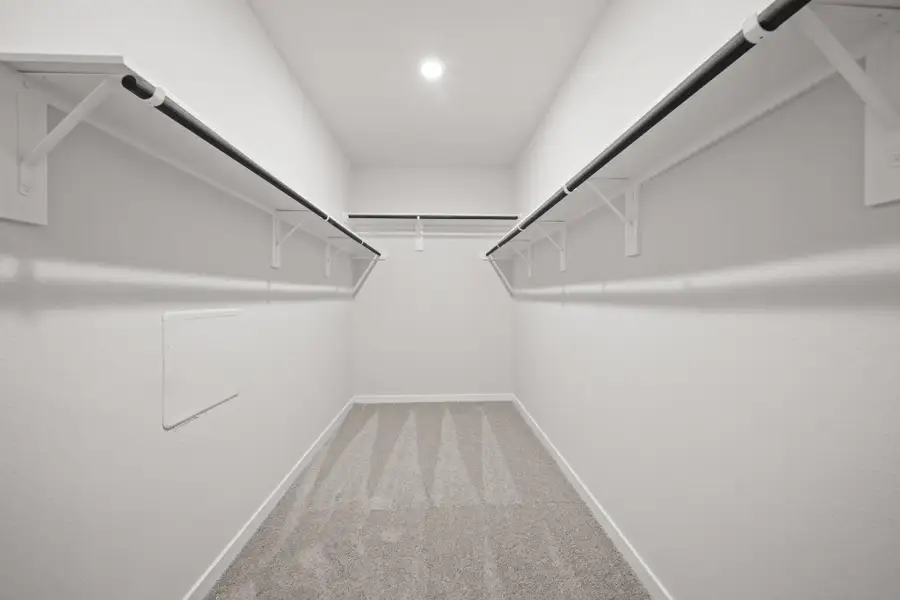 Furnished interior view inside a new home in Sunterra, Katy (Image 6).