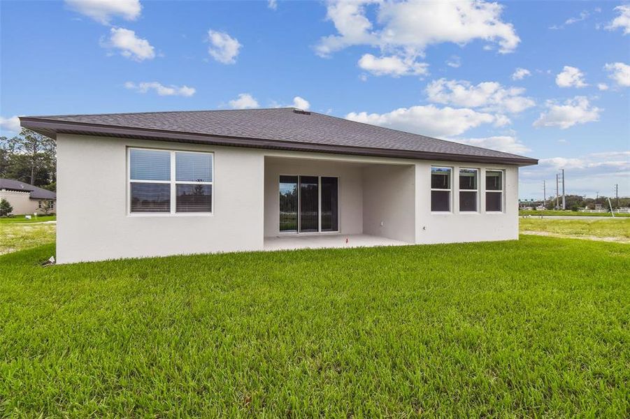 Front exterior of a new home in Hidden Ridge, New Port Richey, FL, highlighting curb appeal (Image 24). Front exterior of a new home in Hidden Ridge, New Port Richey, FL, highlighting curb appeal (Image 24).