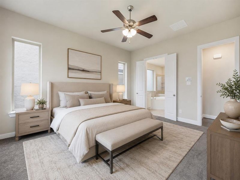 Spacious bedroom featuring light-colored walls, carpet flooring, a ceiling fan with light fixture, and two tall windows providing natural light