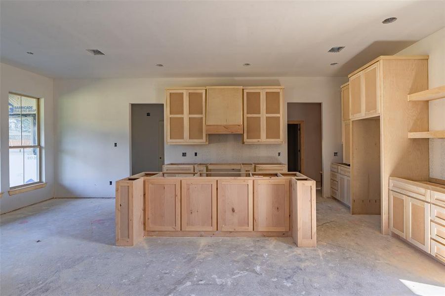 Kitchen featuring light brown cabinets