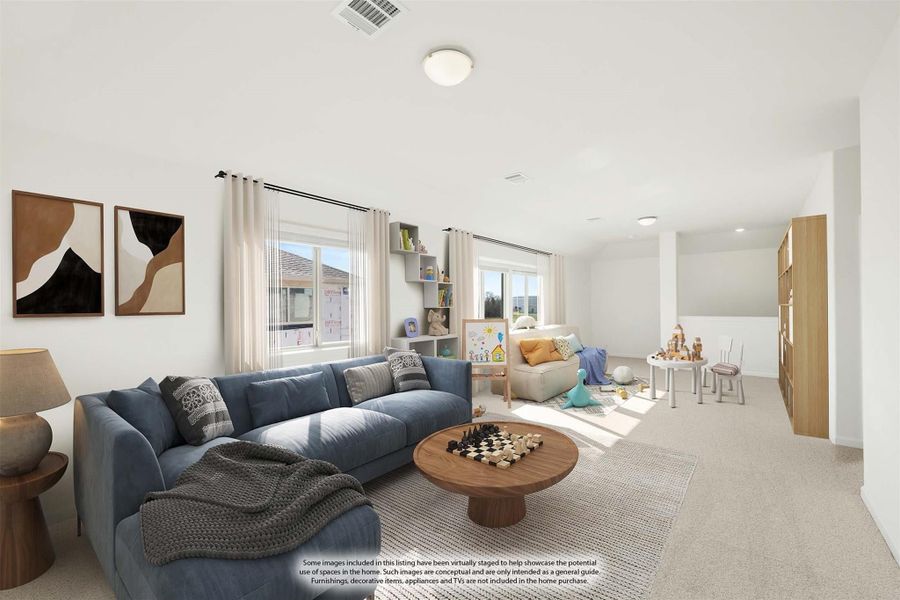 Spacious loft with blue sectional sofa, round coffee table, and children's play area on carpet