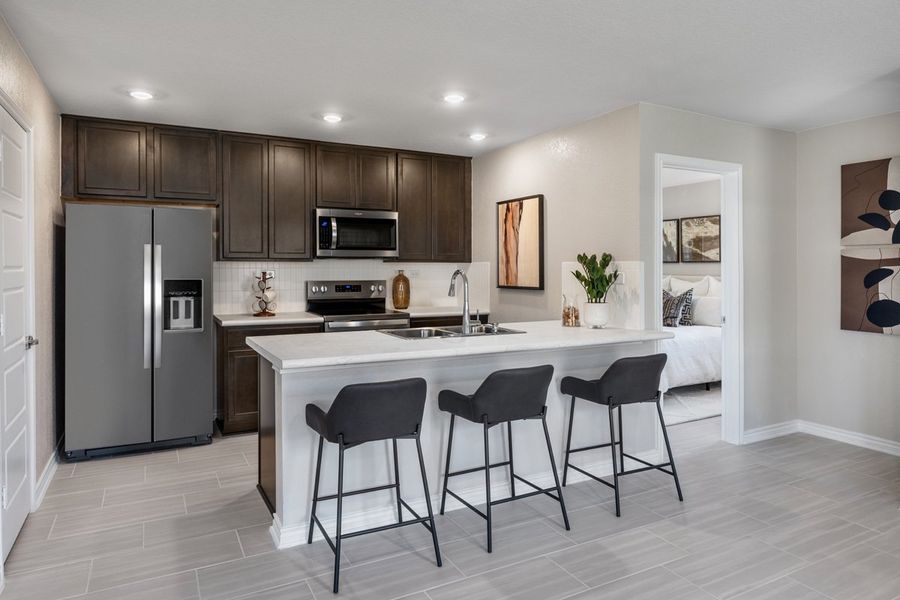 Representative furnished interior of a home built from the Plan 1417 Modeled by KB Home in The Granary - Heritage Collection, San Antonio (Image 5). Representative furnished interior of a home built from the Plan 1417 Modeled by KB Home in The Granary - Heritage Collection, San Antonio (Image 5).